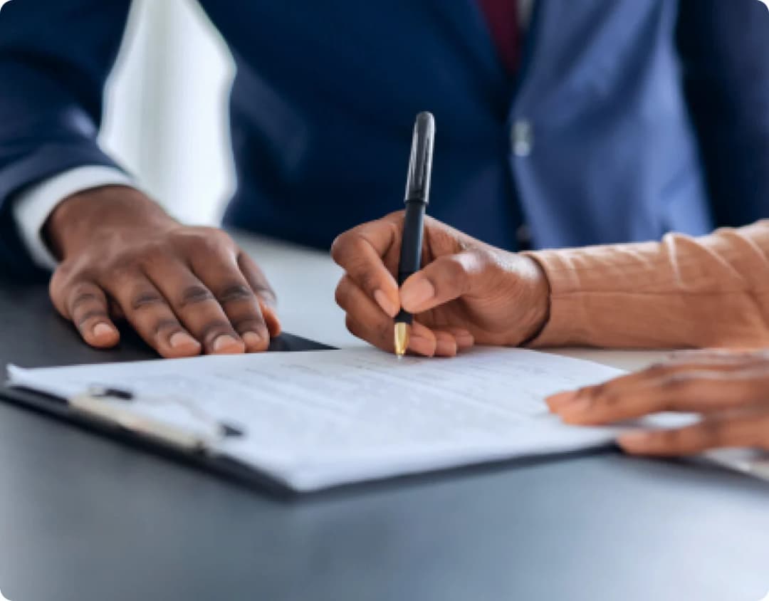 Loan signing image - man signing a loan contract